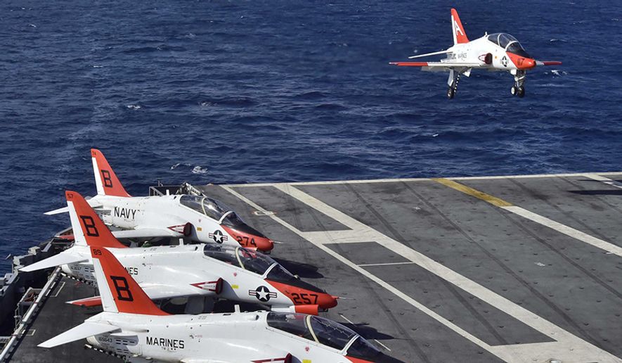 A T-45C Goshawk assigned to Carrier Training Wing (CTW) 2 lands on the flight deck of the aircraft carrier USS Dwight D. Eisenhower (CVN 69). (U.S. Navy photo by Mass Communication Specialist 3rd Class Jameson E. Lynch/Released) **FILE**