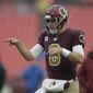 Washington Redskins quarterback Case Keenum warms up before an NFL football game against the San Francisco 49ers, Sunday, Oct. 20, 2019, in Landover, Md. (AP Photo/Julio Cortez)