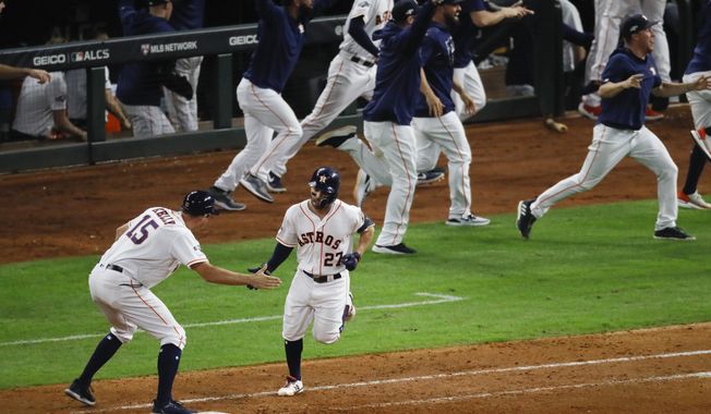 Houston Astros&#x27; Jose Altuve rounds the bases after a two-run walk-off to win Game 6 of baseball&#x27;s American League Championship Series against the New York Yankees Saturday, Oct. 19, 2019, in Houston. The Astros won 6-4 to win the series 4-2. (AP Photo/Sue Ogrocki)