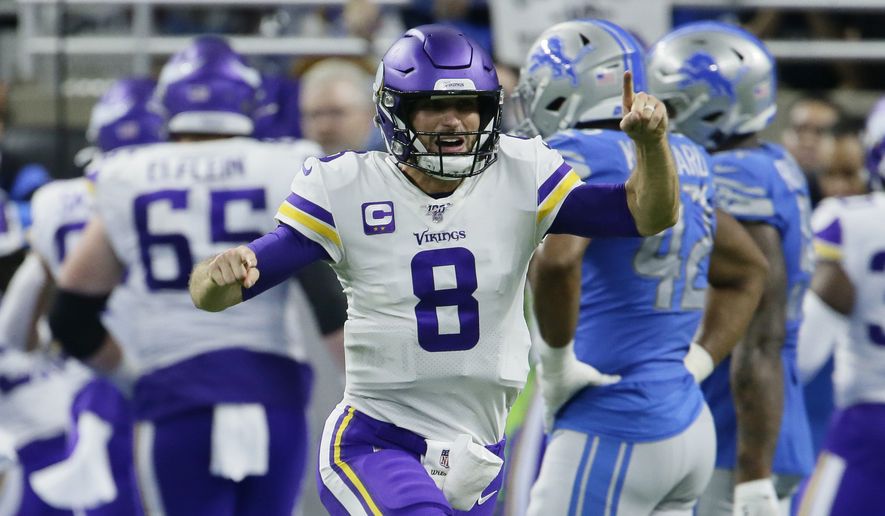 Minnesota Vikings quarterback Kirk Cousins (8) reacts after a touchdown by running back Dalvin Cook during the second half of an NFL football game against the Detroit Lions, Sunday, Oct. 20, 2019, in Detroit. (AP Photo/Duane Burleson)