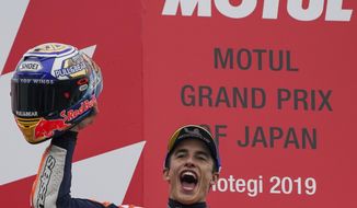 Spain&#39;s MotoGP rider Marc Marquez celebrates after winning the MotoGP Japanese Motorcycle Grand Prix at the Twin Ring Motegi circuit in Motegi, north of Tokyo, Sunday, Oct. 20, 2019. (AP Photo/Christopher Jue)