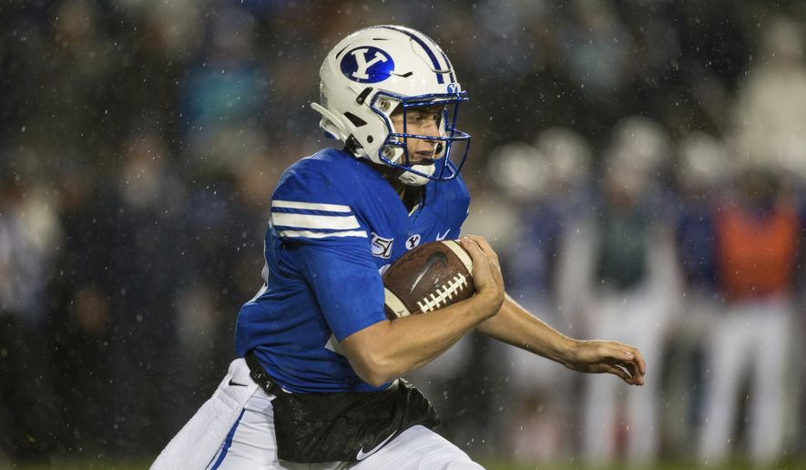 BYU quarterback Baylor Romney runs during the first half of the team's NCAA college football game against Boise State on Saturday, Oct. 19, 2019, in Provo, Utah. (AP Photo/Tyler Tate)
