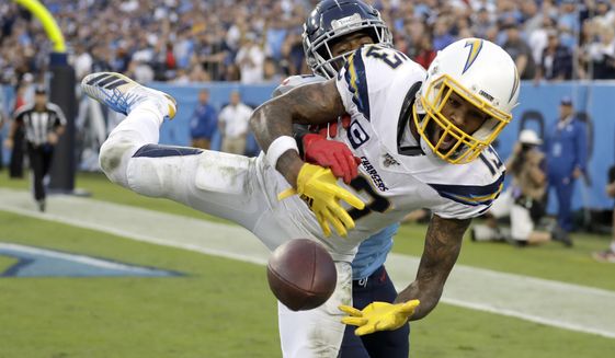 Los Angeles Chargers wide receiver Keenan Allen (13) can&#39;t hold onto a pass in the end zone as he is defended by Tennessee Titans cornerback Logan Ryan in the fourth quarter of an NFL football game Sunday, Oct. 20, 2019, in Nashville, Tenn. (AP Photo/James Kenney)