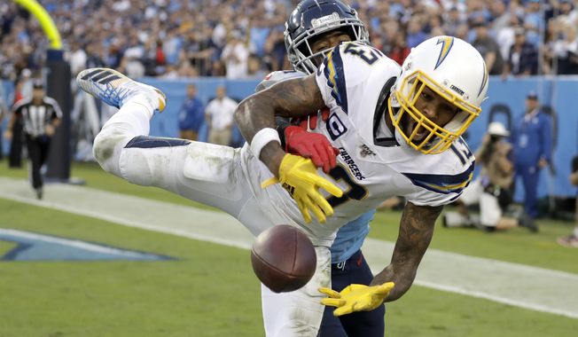 Los Angeles Chargers wide receiver Keenan Allen (13) can&#x27;t hold onto a pass in the end zone as he is defended by Tennessee Titans cornerback Logan Ryan in the fourth quarter of an NFL football game Sunday, Oct. 20, 2019, in Nashville, Tenn. (AP Photo/James Kenney)