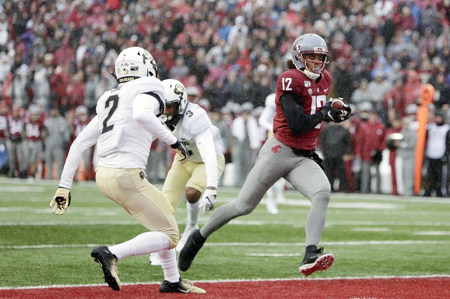 Washington State wide receiver Dezmon Patmon (12) runs for a touchdown in front of Colorado safety Mikial Onu (2) during the first half of an NCAA college football game in Pullman, Wash., Saturday, Oct. 19, 2019. (AP Photo/Young Kwak)
