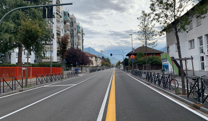 A view of a deserted road in the northern Italian city of Bolzano, Sunday, Oct. 20,2 019. Italian authorities have evacuated 4,000 people from the center of the northern city of Bolzano to defuse a World War II bomb found during construction. The news agency ANSA said the bomb was defused during a three-hour operation Sunday morning. (G.news/ANSA via AP)