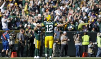 Green Bay Packers&#39; Aaron Rodgers reacts after throwing a touchdown pass to Jake Kumerow during the first half of an NFL football game against the Oakland Raiders Sunday, Oct. 20, 2019, in Green Bay, Wis. (AP Photo/Jeffrey Phelps)