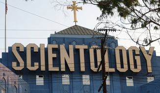 This Aug. 25, 2016, photo shows the Scientology Cross perched atop the Church of Scientology in Los Angeles. Scientology is about to get its own television channel starting Monday, March 11, 2018. A Twitter handle, website and app for Scientology TV appeared Sunday posting updates to hype the network&#39;s availability on DIRECTV, AppleTV, Roku, fireTV, Chromecast, iTunes and Google Play. (AP Photo/Richard Vogel)