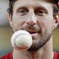 Washington Nationals starting pitcher Max Scherzer warms up during batting practice for baseball&#39;s World Series Monday, Oct. 21, 2019, in Houston. The Houston Astros face the Washington Nationals in Game 1 on Tuesday. (AP Photo/Eric Gay) **FILE**