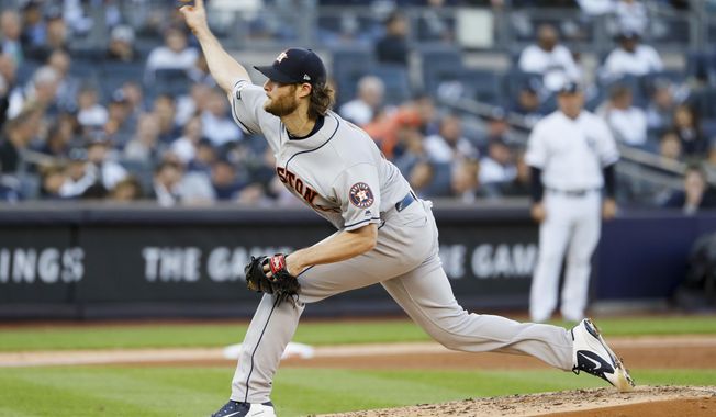 Houston Astros starting pitcher Gerrit Cole throws against the New York Yankees during the second inning in Game 3 of baseball&#x27;s American League Championship Series Tuesday, Oct. 15, 2019, in New York. (AP Photo/Matt Slocum)