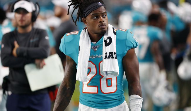 FILE -  In this Aug. 8, 2019, file photo, Miami Dolphins safety Bobby McCain watches during the second half of a preseason NFL football game against the Atlanta Falcons in Miami Gardens, Fla. McCain will be disciplined by the team for his verbal confrontation with a 13-year-old boy who was rooting for the Buffalo Bills. (AP Photo/Wilfredo Lee, File)