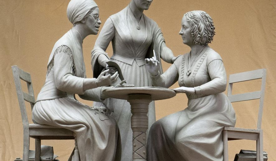 This Oct. 6, 2019 photo provided by Michael Bergmann shows a one-third scale clay model of Sojourner Truth, left, Susan B. Anthony, center, and Elizabeth Cady Stanton at Meredith Bergmann's studio in Ridgefield, Conn. A New York City commission voted Monday, Oct. 21 to erect a tribute to the three civil rights pioneers. Meredith Bergmann's work is to be dedicated next August in Central Park, marking the 100th anniversary of women's suffrage in the United States. (Michael Bergmann via AP)