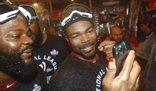 Washington Nationals&#x27; Howie Kendrick celebrates after Game 4 of the baseball National League Championship Series against the St. Louis Cardinals Wednesday, Oct. 16, 2019, in Washington. The Nationals won 7-4 to win the series 4-0. (AP Photo/Patrick Semansky)