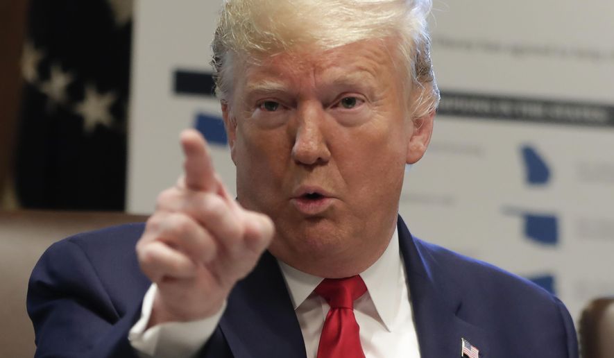 President Donald Trump gestures while speakings during a Cabinet meeting in the Cabinet Room of the White House, Monday, Oct. 21, 2019, in Washington. (AP Photo/Pablo Martinez Monsivais)