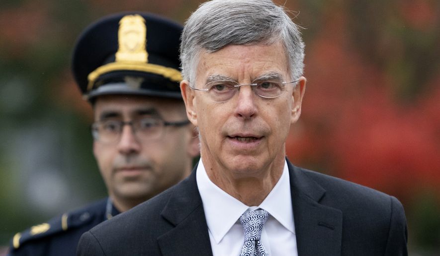 Ambassador William Taylor is escorted by U.S. Capitol Police as he arrives to testify before House committees as part of the Democrats' impeachment investigation of President Donald Trump, at the Capitol in Washington, Tuesday, Oct. 22, 2019. (AP Photo/J. Scott Applewhite)