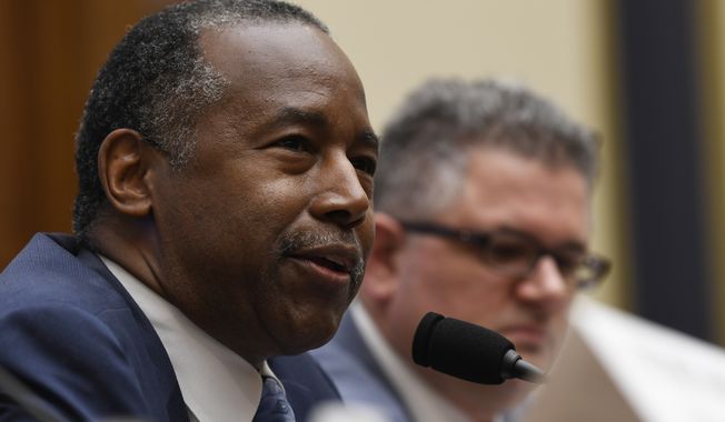 Housing and Urban Development Secretary Ben Carson, left, testifies before the House Financial Services Committee hearing on Capitol Hill in Washington, Tuesday, Oct. 22, 2019, on housing finance plans. (AP Photo/Susan Walsh)