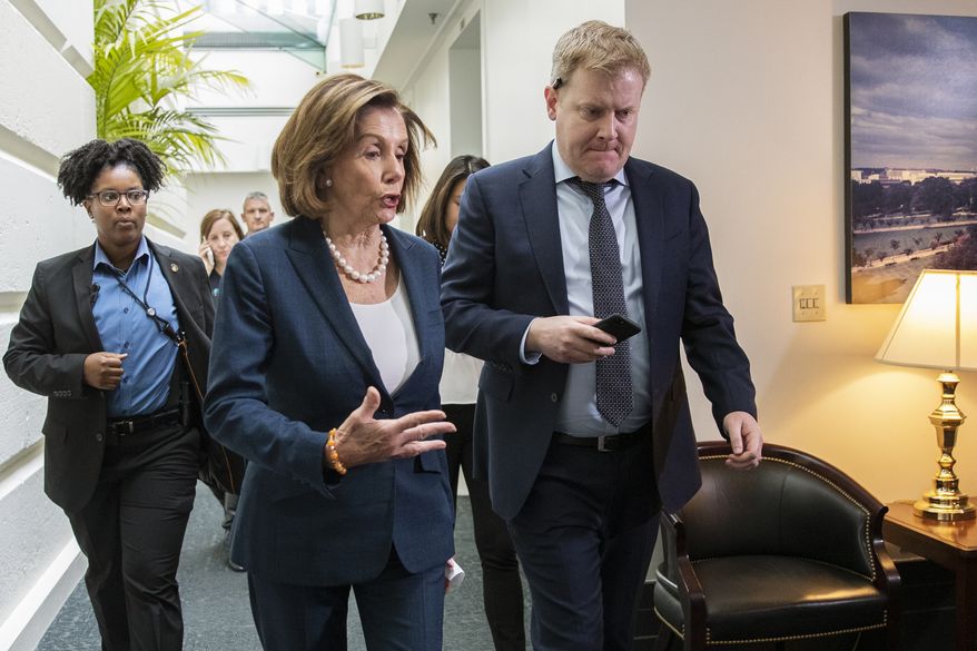 House Speaker Nancy Pelosi of Calif., walks with her staff at the conclusion of a House Democratic Caucus meeting on Capitol Hill in Washington, Tuesday, Oct. 22, 2019. (AP Photo/Manuel Balce Ceneta)