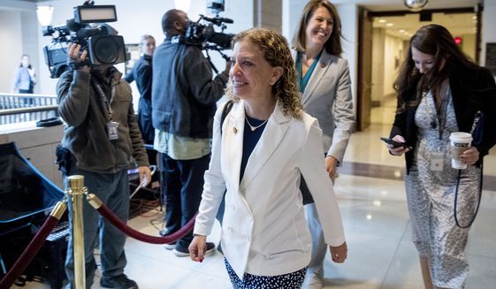 In this file photo, Rep. Debbie Wasserman Schultz, D-Fla., steps out of a closed door meeting where former U.S. Ambassador William Taylor testifies as part of the House impeachment inquiry into President Donald Trump, on Capitol Hill in Washington, Tuesday, Oct. 22, 2019. (AP Photo/Andrew Harnik)  **FILE**