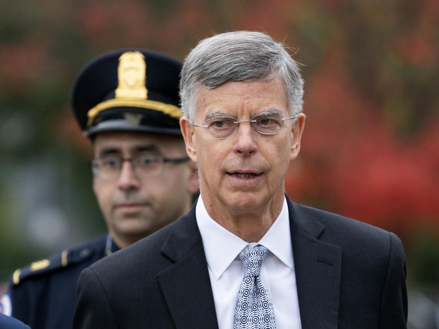 Ambassador William Taylor is escorted by U.S. Capitol Police as he arrives to testify before House committees as part of the Democrats' impeachment investigation of President Donald Trump, at the Capitol in Washington, Tuesday, Oct. 22, 2019. (AP Photo/J. Scott Applewhite)