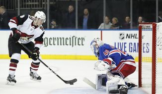 Arizona Coyotes left wing Christian Dvorak (18) looks to shoot against New York Rangers goaltender Alexandar Georgiev (40) during the first period of an NHL hockey game Tuesday, Oct. 22, 2019, in New York. (AP Photo/Kathy Willens)