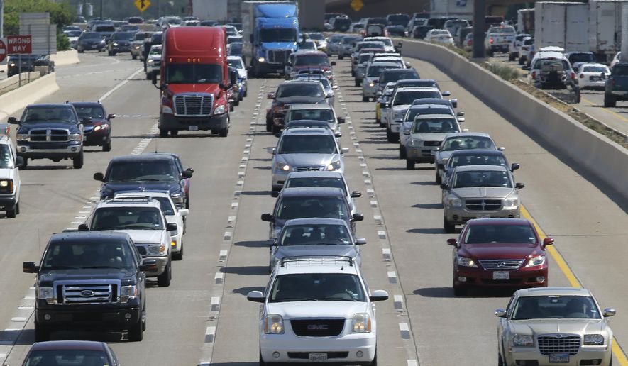 FILE - In this July 1, 2016 file photo, drivers work their way out of Dallas during rush hour. The U.S. government's road safety agency says traffic deaths fell by a small amount for the second straight year. The National Highway Traffic Safety Administration attributed the 2.4% drop partially to technology in newer vehicles that can prevent crashes. The agency says the downward trend is continuing into 2019. First-half estimates show fatalities down 3.4%. (AP Photo/LM Otero, File)