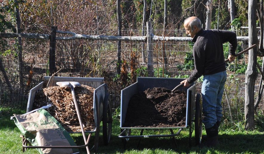 This undated photo shows mulches ready for spreading in New Paltz, N.Y. Compost and wood chips are among the many organic mulches that provide multiple benefits to plants and the soil when spread on top of the ground. (Lee Reich via AP)