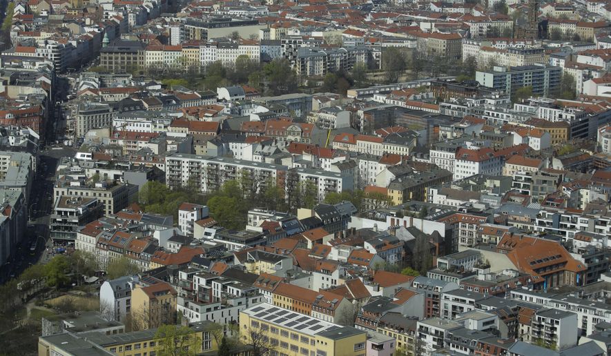 FILE - In this Thursday, April 4, 2019, file photo, Apartment buildings in the district Mitte photographed from the television tower in Berlin, Germany. Berlin's state government has agreed on a rent freeze for five years to counter rising rents in one of Germany's hottest real estate markets. (AP Photo/Markus Schreiber, file)