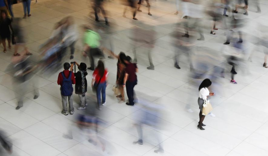 FILE - In this June 15, 2017, file photo, people walk inside the Oculus, the new transit station at the World Trade Center in New York. Financial fears, not wanting to check your credit, confront your debt or even discuss your student loans, can feel especially shameful. But facing those fears can empower you to take action. (AP Photo/Frank Franklin II, File)