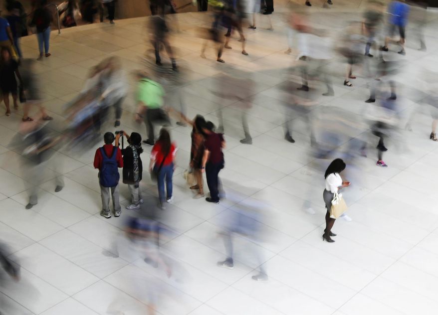 FILE - In this June 15, 2017, file photo, people walk inside the Oculus, the new transit station at the World Trade Center in New York. Financial fears, not wanting to check your credit, confront your debt or even discuss your student loans, can feel especially shameful. But facing those fears can empower you to take action. (AP Photo/Frank Franklin II, File)