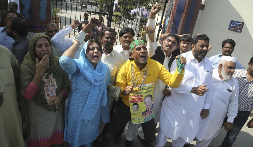 Supporters of Pakistani former Prime Minister Nawaz Sharif shout anti-government slogans outside a hospital in Lahore, Pakistan, Tuesday, Oct. 22, 2019. Sharif, who was convicted on corruption charges, has been rushed to hospital from the prison after recent blood tests raised doctors&#39; concerns. (AP Photo/K.M. Chaudary, File