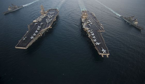 U.S. FIFTH FLEET AREA OF RESPONSIBILITY (Sept. 27, 2012) The Aircraft carrier USS Enterprise (CVN 65), center right, the Nimitz-class aircraft carrier USS Dwight D. Eisenhower (CVN 69), and the Ticonderoga-class guided-missile cruisers USS Vicksburg (CG 69), far right, and USS Hue City (CG 66) are underway in formation during a passing exercise. Enterprise, Eisenhower, Vicksburg and Hue City are deployed to the U.S. 5th Fleet area of responsibility conducting maritime security operations, theater security cooperation efforts and support missions as part of Operation Enduring Freedom. Join the conversation on social media using #warfighting. (U.S. Navy photo by Mass Communication Specialist 3rd Class Scott Pittman/Released) 120927-N-FI736-597 Join the conversation http://www.facebook.com/USNavy http://www.twitter.com/USNavy http://navylive.dodlive.mil