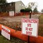 In this Tuesday, Oct. 22, 2019 photo, a sign is posted at a construction site on the Mariner East pipeline in a residential neighborhood in Exton, Pa. The 350-mile (560-kilometer) pipeline route traverses those suburbs, close to schools, ballfields and senior care facilities. The spread of drilling, compressor stations and pipelines has changed neighborhoods — and opinions.  (AP Photo/Matt Rourke)