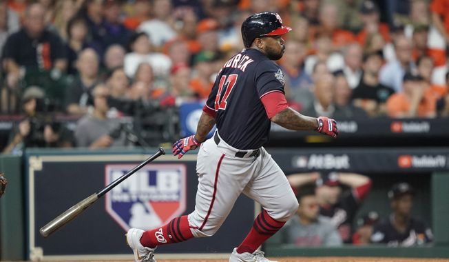 Washington Nationals&#x27; Howie Kendrick hits an RBI single during the seventh inning of Game 2 of the baseball World Series Wednesday, Oct. 23, 2019, in Houston. (AP Photo/David J. Phillip) ** FILE **