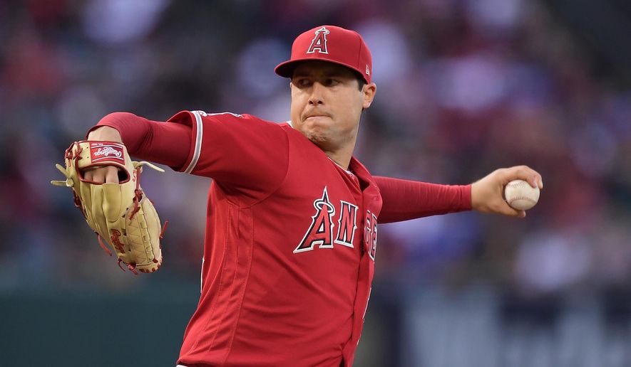 FILE - In this May 25, 2019, file photo, Los Angeles Angels starting pitcher Tyler Skaggs throws during the first inning of a baseball game against the Texas Rangers in Anaheim, Calif. The Angels say they do not know whether a longtime public relations official had been providing drugs to late pitcher Skaggs, as detailed in a report on ESPN's "Outside the Lines." Eric Kay, a 24-year employee of the Angels' PR department, told the Drug Enforcement Agency he had provided opioids to Skaggs and used them with the pitcher for years, according to the ESPN report Saturday, Oct. 12, 2019. Kay reportedly watched as Skaggs snorted three lines of crushed pills in his hotel room in Texas, on the night before he was found dead. (AP Photo/Mark J. Terrill, File)