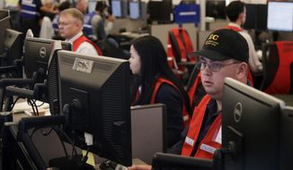 FILE - In this Oct. 10, 2019, file photo, Pacific Gas &amp;amp; Electric employees work in the PG&amp;amp;E Emergency Operations Center in San Francisco. Authorities say power outages have started Wednesday, Oct. 23, 2019, in Northern California after the state&#39;s largest utility said it was planning a widespread blackout citing wildfire danger. The Santa Rosa Fire Department tweeted Wednesday that shutoffs had started in the city and it was getting multiple reports of outages. Pacific Gas &amp;amp; Electric said earlier Wednesday it was going forward with blackouts later in the day that could affect 450,000 people in 17 counties of Northern California. (AP Photo/Jeff Chiu, File)