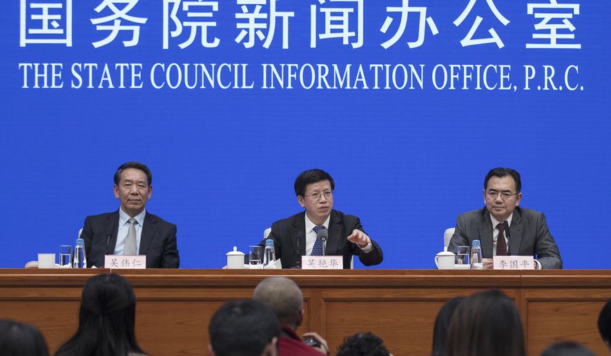 In this Jan. 14, 2019, photo released by Xinhua News Agency, Wu Yanhua, center, vice chairman of the China National Space Administration speaks during a press conference on Chang&#x27;e-4 mission, at the State Council Information Office in Beijing. China is accusing the U.S. of having &amp;quot;weaponized&amp;quot; visa issuance following the reported inability of a top Chinese space program official to obtain permission to travel to a key conference in Washington. Foreign Ministry spokeswoman Hua Chunying told reporters Wednesday, Oct. 23 that the head of the Chinese delegation to the International Astronautical Congress wasn&#x27;t able to obtain a visa, making it difficult for Chinese representatives to attend important events at the meeting. (Jin Liwang/Xinhua via AP)