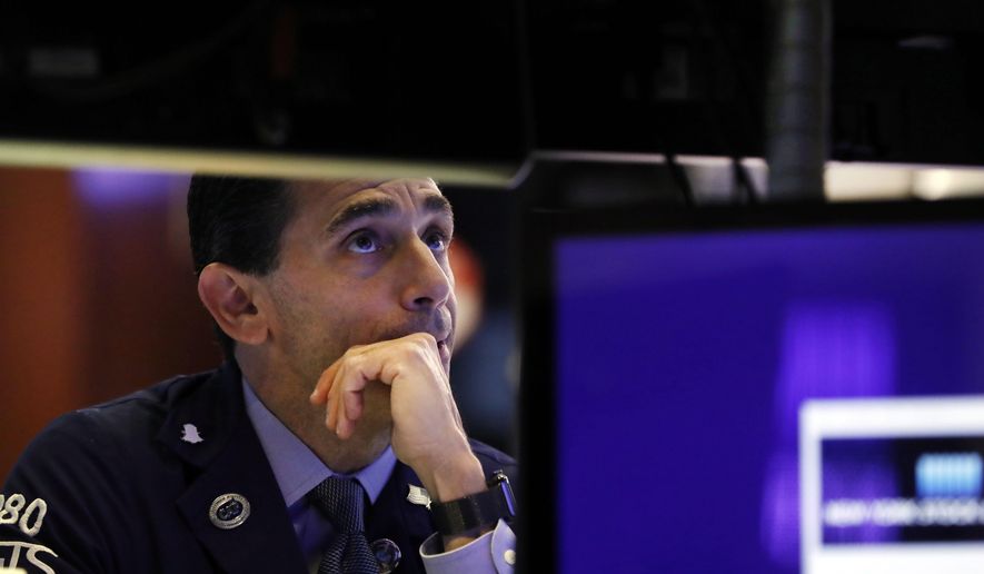 FILE - In this Oct. 2, 2019, file photo specialist Peter Mazza works on the floor of the New York Stock Exchange. The U.S. stock market opens at 9:30 a.m. EDT on Wednesday, Oct. 23. (AP Photo/Richard Drew, File)