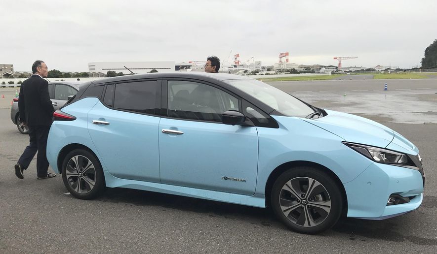 In this Oct. 18, 2019, photo, Nissan's electric vehicle with new "all-wheel-control" technology is ready for a demonstration to reporters at its Oppama test driving course in Yokosuka, near Tokyo. The electric car with smooth four-wheel drive and a virtual friend for the coming age of automated driving are among the technology in development from Nissan. The Japanese automaker is eager to put the scandal over its former star executive Carlos Ghosn behind it. Nissan’s newly developed “all-wheel-control” technology delivers a sense of greater control and safety. (AP Photo/Yuri Kageyama)