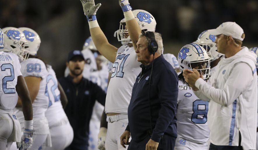 North Carolina coach Mack Brown watches after his squad made a field goal in overtime against Virginia Tech during an NCAA college football game Saturday, Oct. 19, 2019, in Blacksburg, Va. (Matt Gentry/The Roanoke Times via AP)