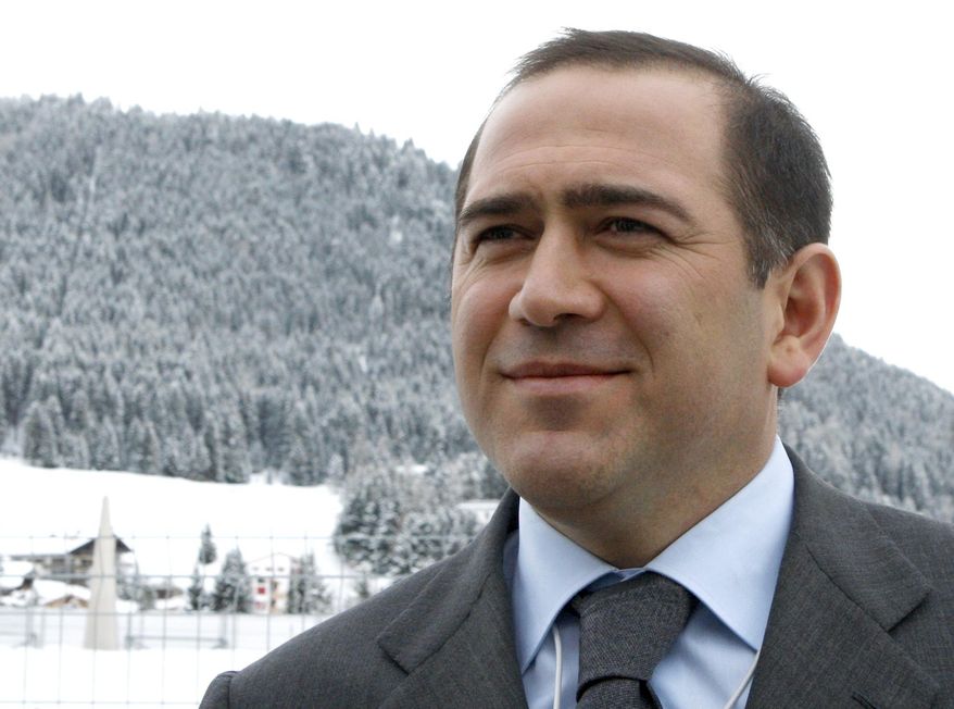 FILE - In this Jan. 26, 2011 file photo Akhmed Bilalov speaks with The Associated Press on the sidelines of the World Economic Forum in Davos, Switzerland. Bilalov, a former Russian Olympic Committee official, who fled the country following accusations by President Vladimir Putin was arrested Tuesday, Oct. 22, 2019, at his home in Sunny Isles, Fla., on an alleged immigration violation. (AP Photo/Michel Euler, File)
