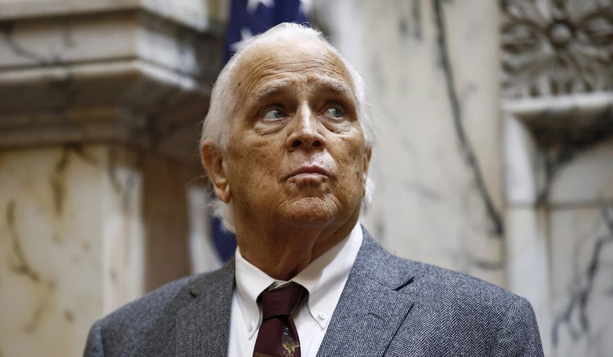 FILE - In a Wednesday, Jan. 30, 2019 file photo, Maryland Senate President Thomas V. Mike Miller stands in the House of Delegates chamber in Annapolis, Md. Miller, who is 76 and the longest-serving state Senate president in the nation, is planning to meet with the chamber’s 31 other Democrats in a closed-door caucus meeting Thursday, Oct. 24, 2019. He is expected to discuss his future political plans as he continues a battle with cancer. (AP Photo/Patrick Semansky, File)