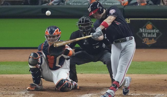 Washington Nationals&#x27; Ryan Zimmerman hits a home run during the second inning of Game 1 of the baseball World Series against the Houston Astros Tuesday, Oct. 22, 2019, in Houston. (AP Photo/Eric Gay)