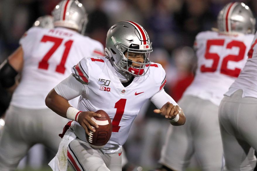 Ohio State quarterback Justin Fields (1) scrambles during the first half of an NCAA college football game against Northwestern, Friday, Oct. 18, 2019, in Evanston, Ill. (AP Photo/Charles Rex Arbogast)