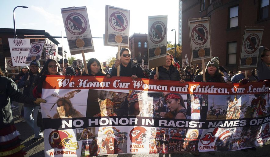 Protesters march from Peavey Park to US Bank Stadium to protest the use of "Redskins" in the name of the Washington NFL football team, and the names of some other pro sports teams, before Washington's game against the Minnesota Vikings on Thursday, Oct. 24, 2019, in Minneapolis. (Richard Tsong-Taatrarii/Star Tribune via AP)