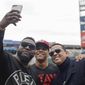 Alex Rodriguez and David Ortiz take a selfie with Washington Nationals&#39; Juan Soto before Game 3 of the baseball World Series against the Houston Astros Friday, Oct. 25, 2019, in Washington. (AP Photo/Pablo Martinez Monsivais)