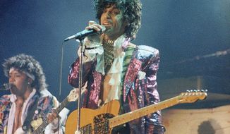 FILE - In this 1985 file photo, singer Prince performs in concert. The Revolution, the band that helped catapult Prince to international superstardom is reuniting in his memory. &amp;quot;Prince: The Beautiful Ones,&amp;quot; the memoir Prince started but didn’t finish before his 2016 death, will be released  on Tuesday, Oct. 29, 2019. (AP Photo/File)