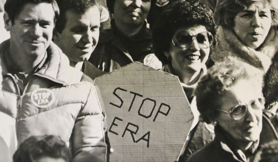 FILE -  In this Feb. 2, 1982 file photo, opponents of the Equal Rights Amendment listen to speakers during a demonstration at the Capitol in Richmond, Va. Advocates of the Equal Rights Amendment are mounting a tremendous effort to elect supporters of the long-stalled gender equality measure next month in Virginia&#x27;s elections. (AP Photo/Steve Helber)