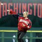 FILE - In this April 14, 2005, file photo, President George W. Bush throws out the ceremonial first pitch at the Washington Nationals home opener in Washington. The Nationals play the Arizona Diamondbacks in the first regular season baseball game in Washington in 34 years. (AP Photo/Evan Vucci) ** FILE **