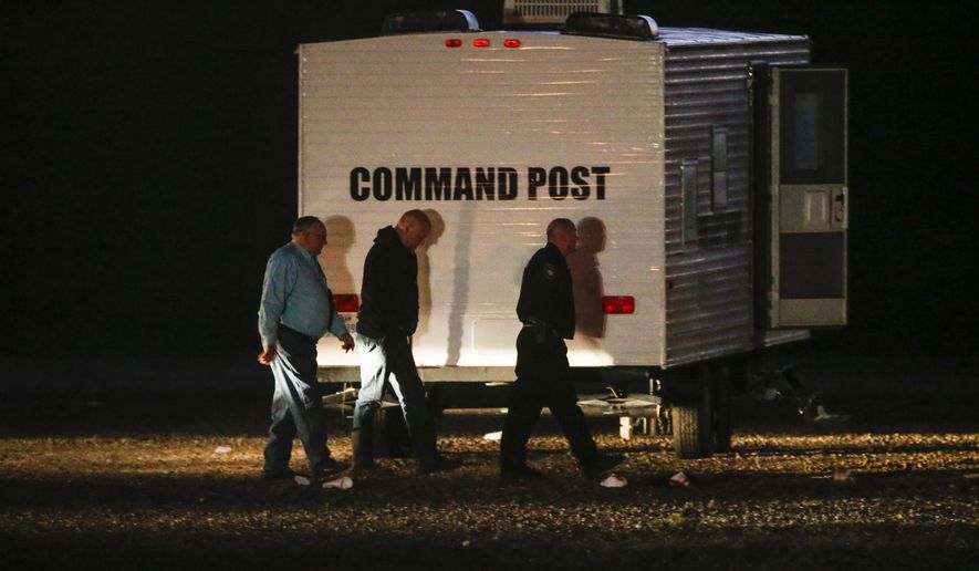 Hunt County Sheriff Randy Meeks, left, arrives at a the scene after a shooting in Greenville, Texas, on Sunday, Oct. 27, 2019. A gunman opened deadly fire at an off-campus Texas A&amp;amp;M University-Commerce party, that left over a dozen injured before he escaped in the ensuing chaos, a sheriff said Sunday. (Ryan Michalesko/The Dallas Morning News via AP)