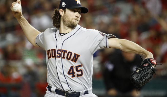 Houston Astros starting pitcher Gerrit Cole throws against the Washington Nationals during the first inning of Game 5 of the baseball World Series Sunday, Oct. 27, 2019, in Washington. (AP Photo/Patrick Semansky)